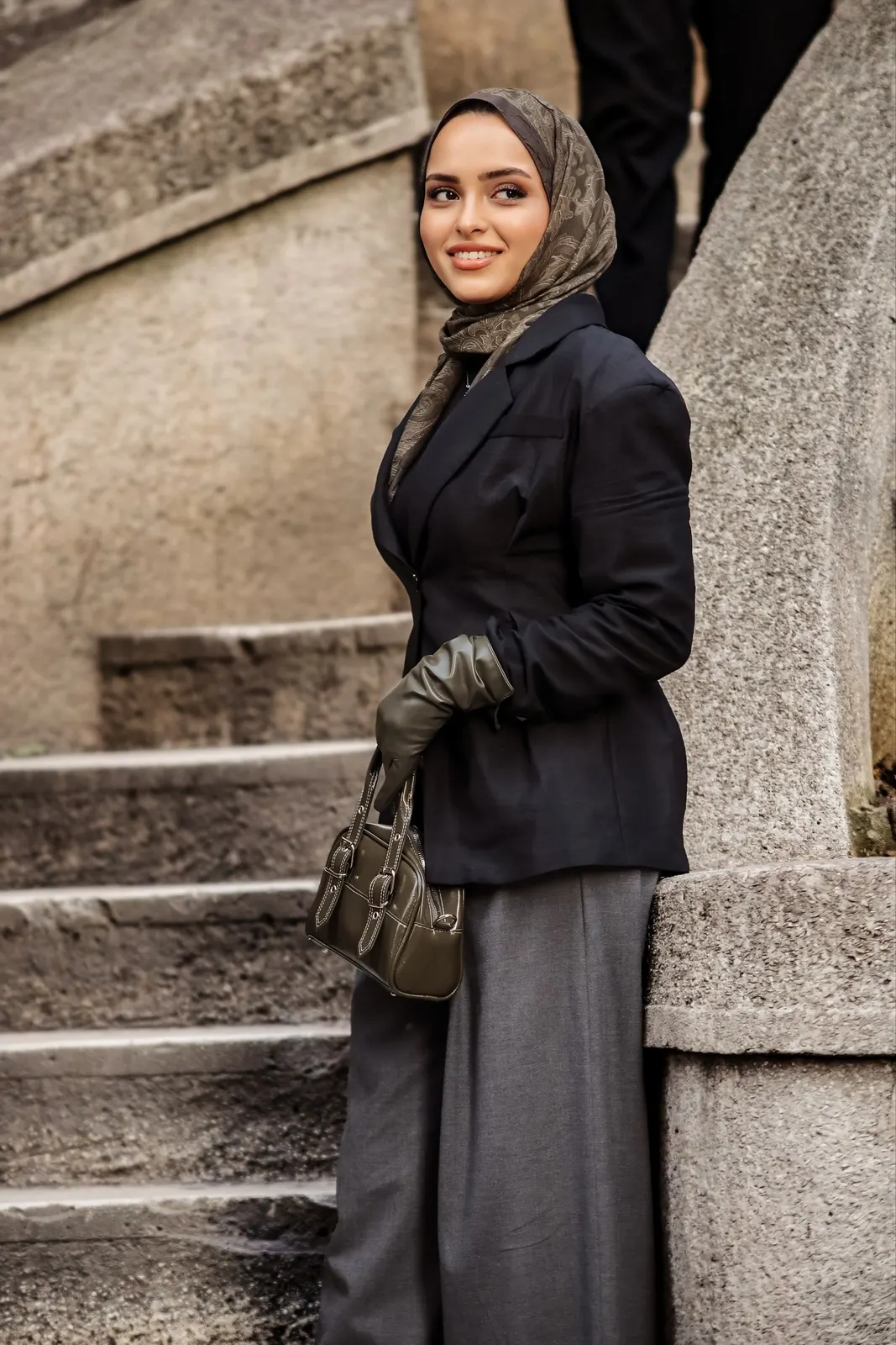 Taupe print hijab with tailoring on stone steps